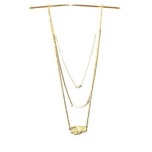 3 layered gold necklace.